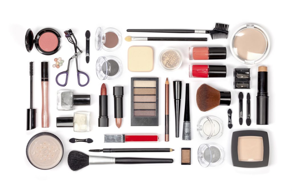 makeup cosmetics and brushes on white background top view